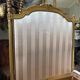 Pair of late 19th-century gilded wooden beds in Louis XVI style.