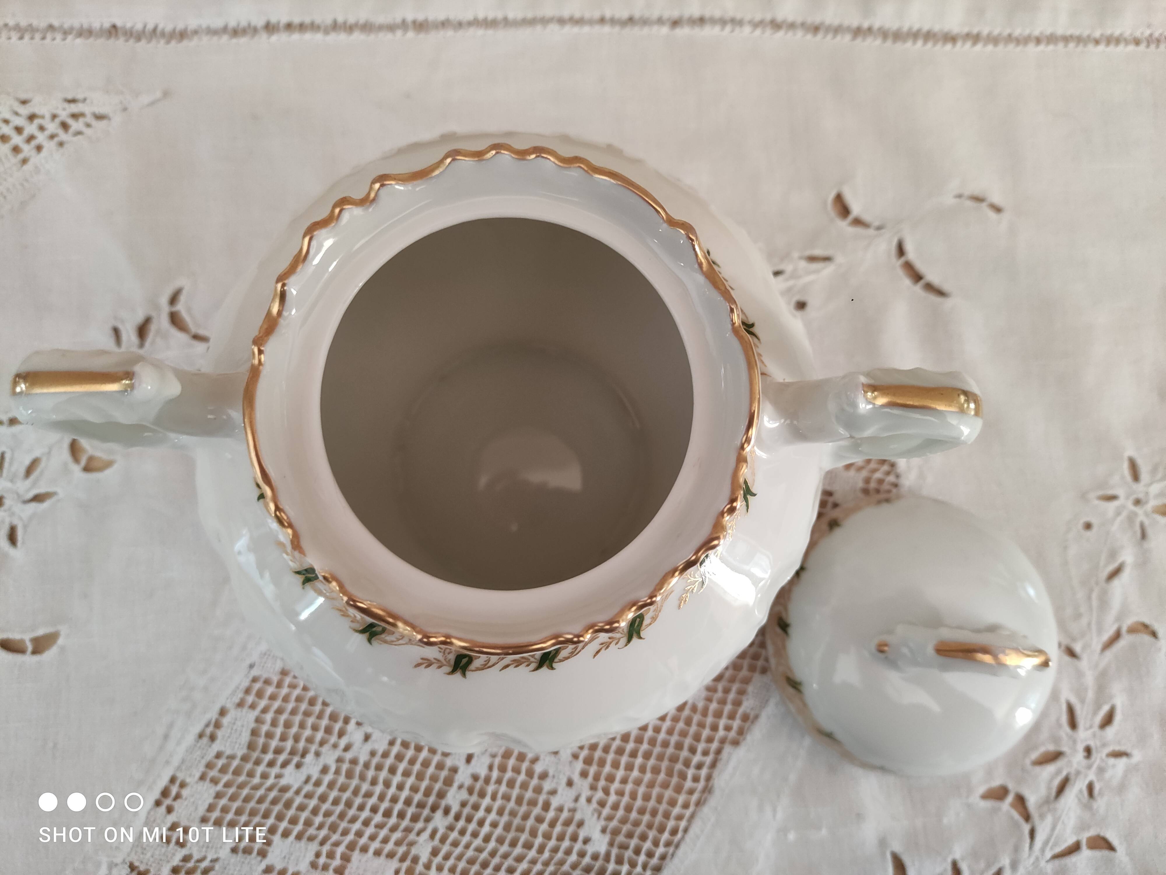 White porcelain sugar bowl decoration in relief and green and gold frieze