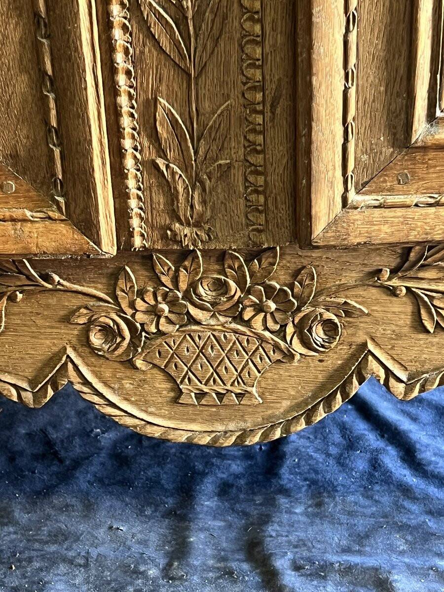 19th-century Norman wedding armoire, with bouquets of flowers and doves.
