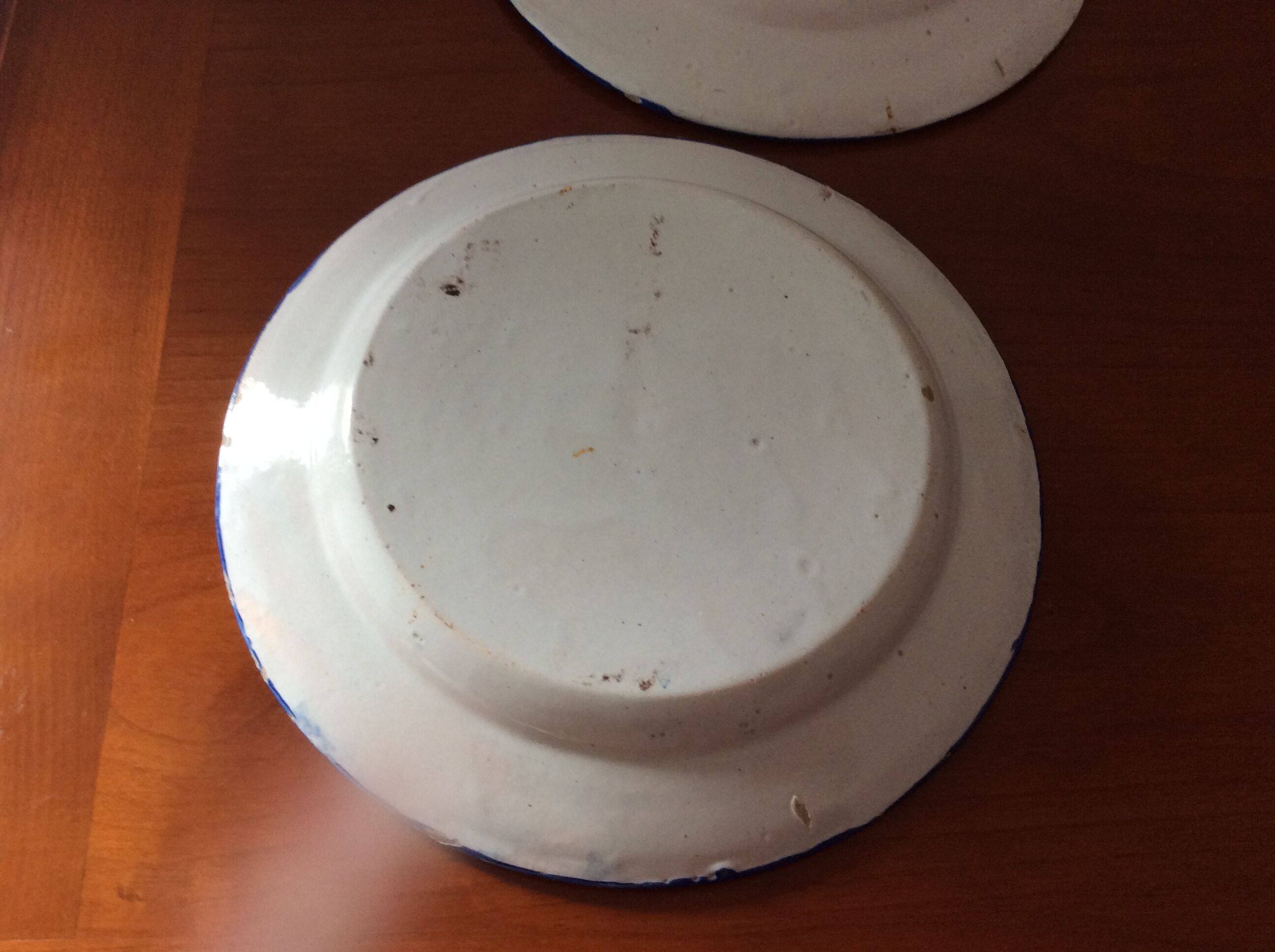 Set of 2 old painted terracotta plates enamelled
