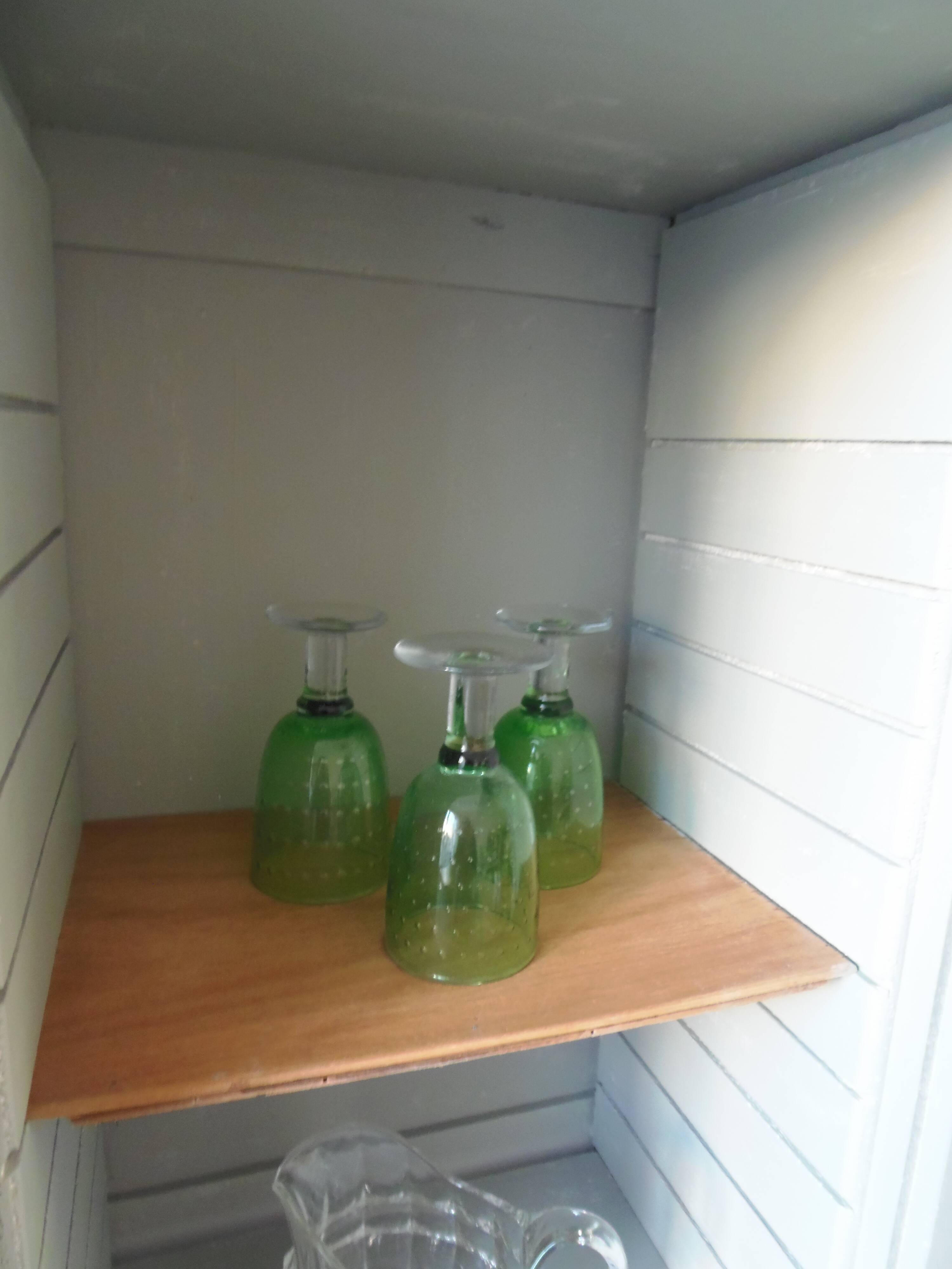 Vintage furniture transformed into a bookcase, verdigris patinated sideboard.