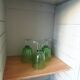 Vintage furniture transformed into a bookcase, verdigris patinated sideboard.