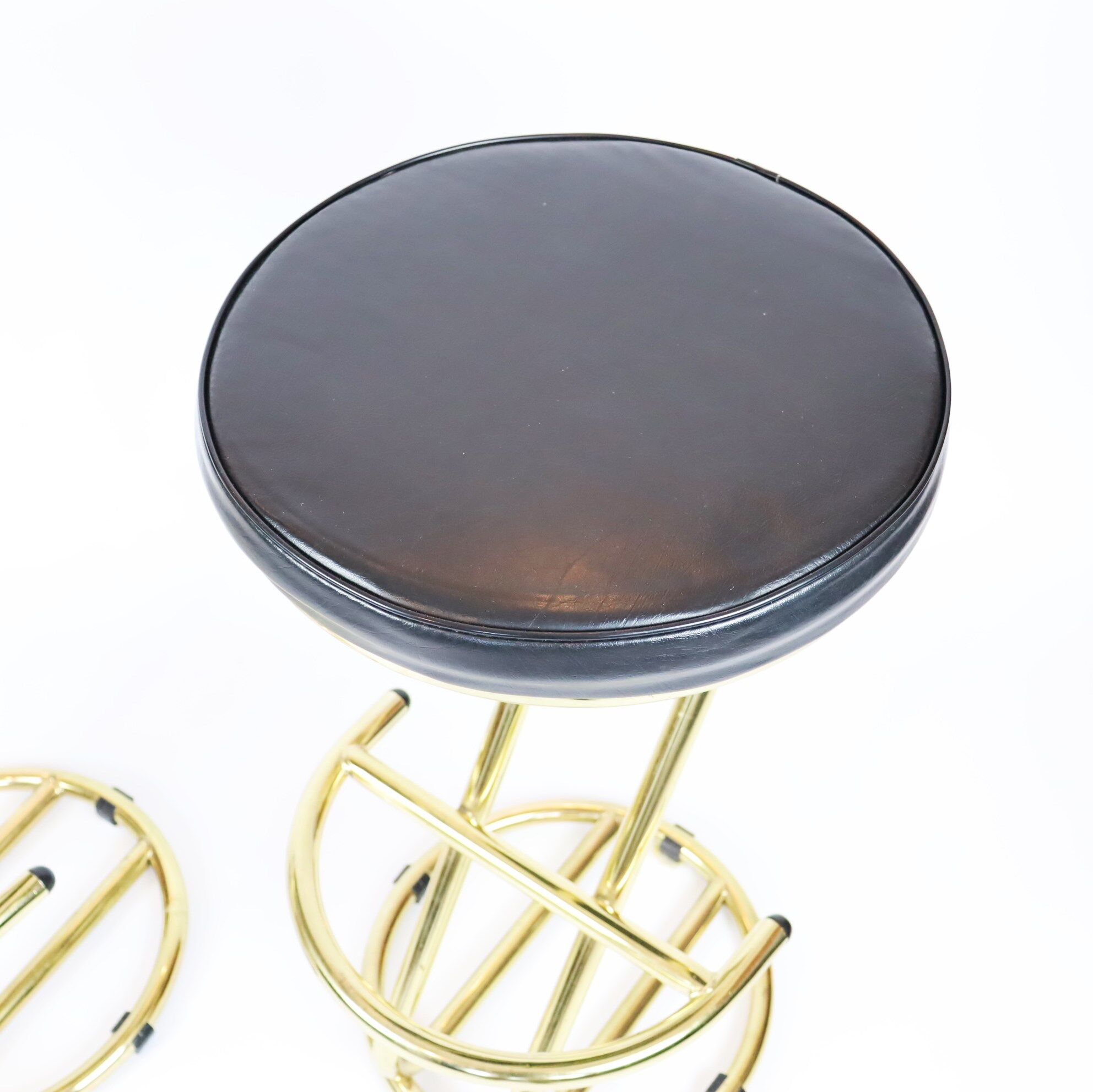 Pair of high brass stools