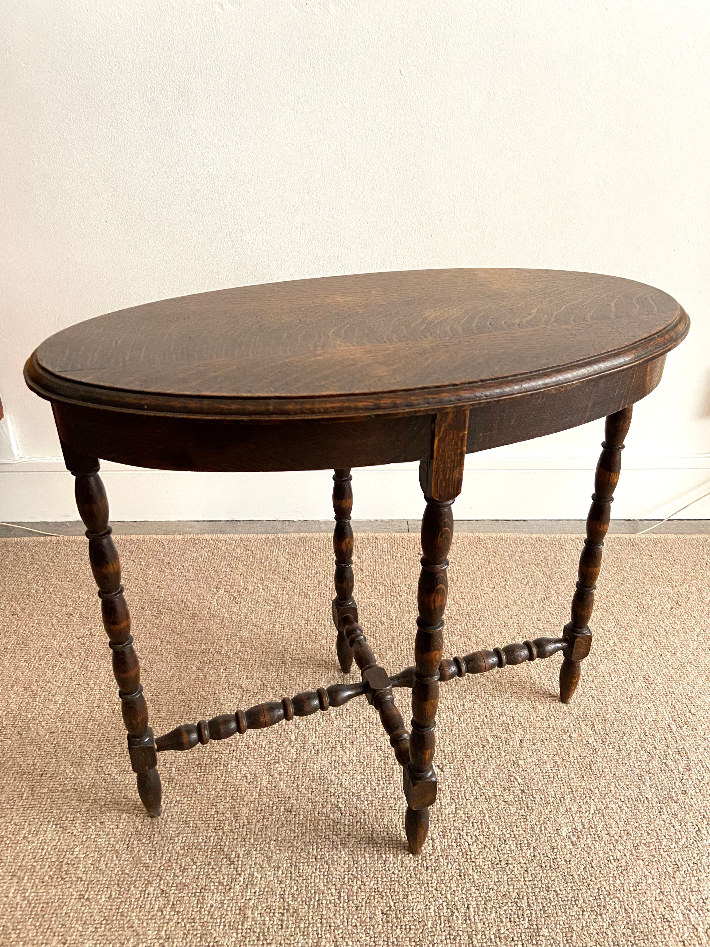 Oval wooden side table turned with spacer