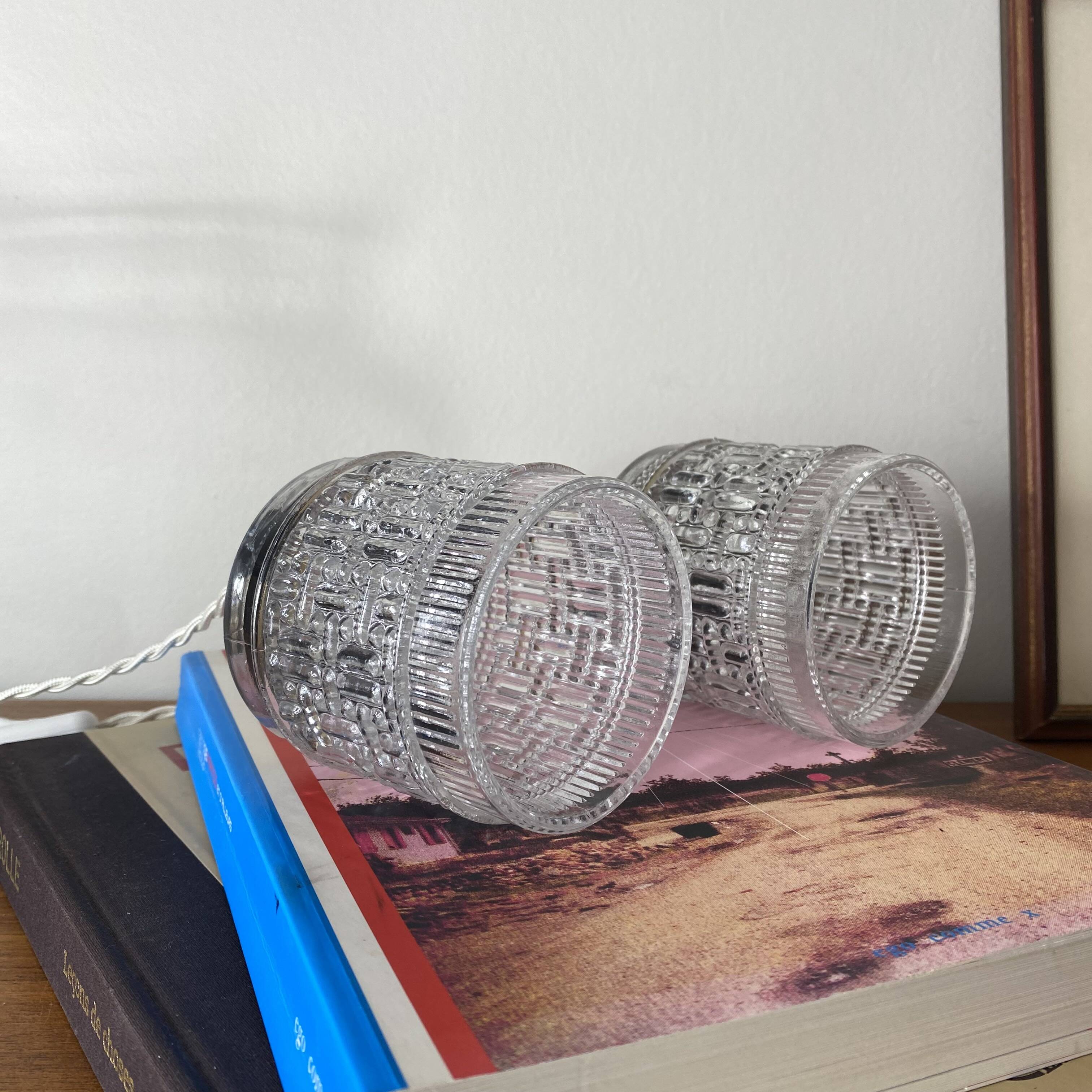 Pair of small portable tulip lamps in transparent glass.