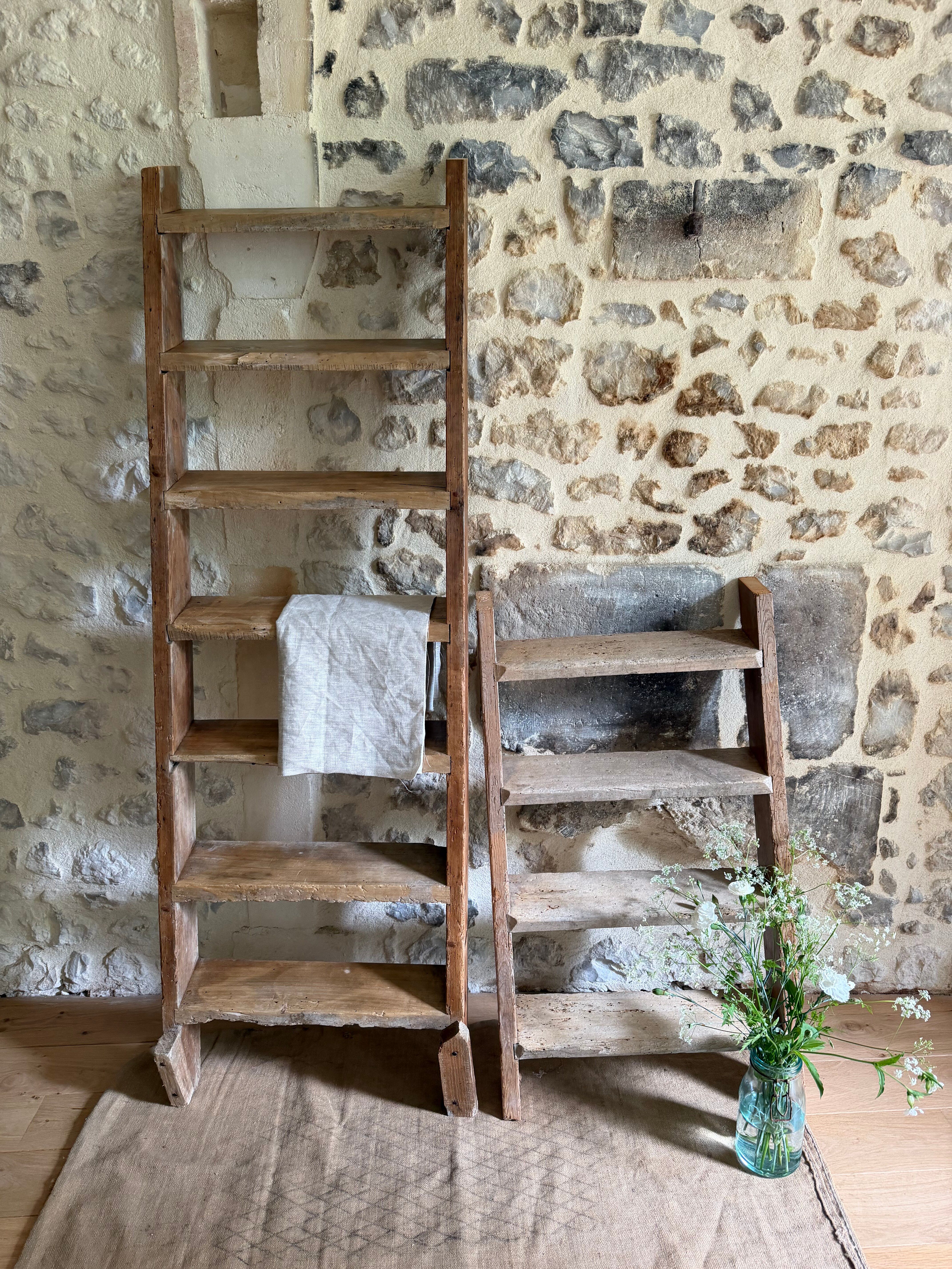 Decorative wooden ladder or towel rack.