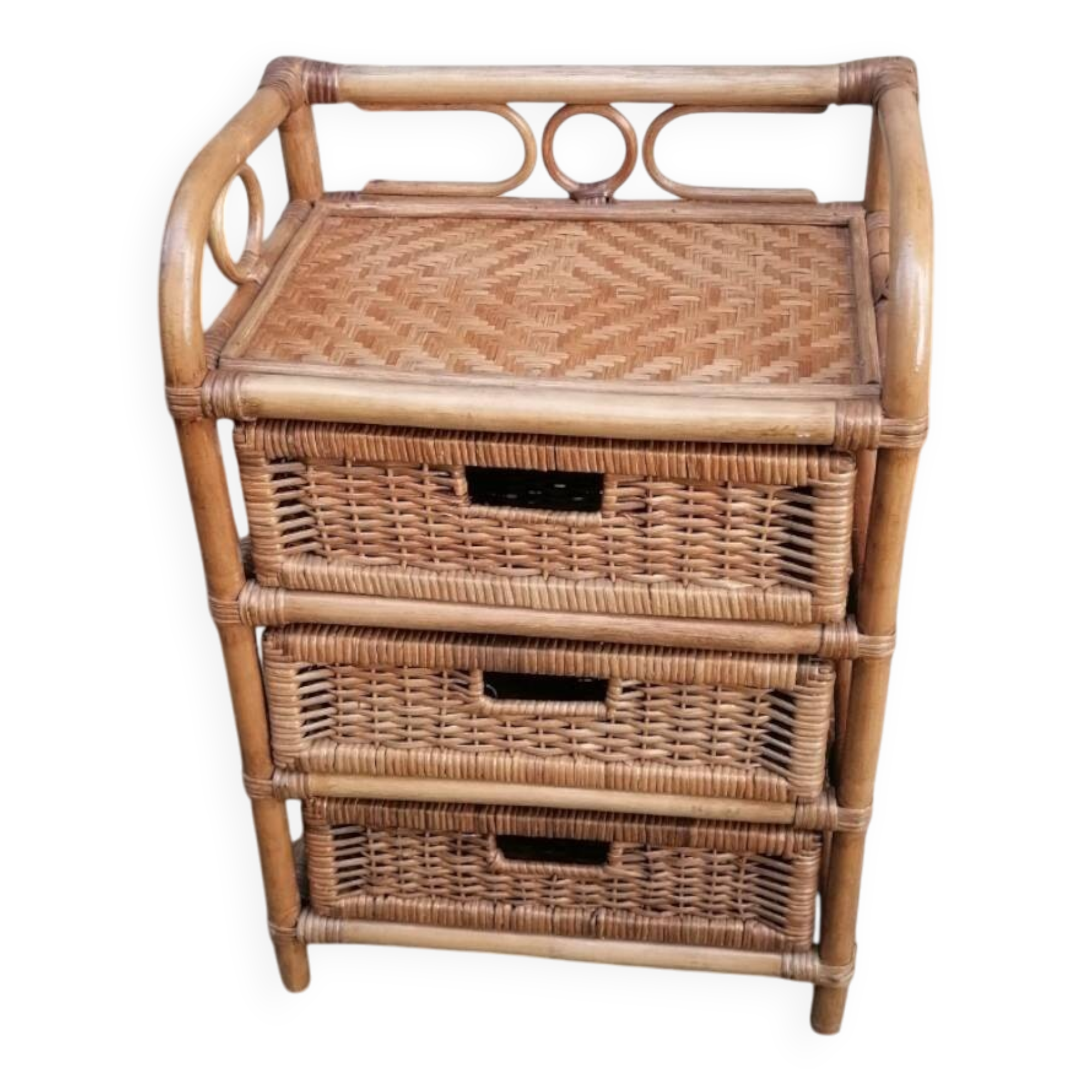 Small storage unit / freestanding shelf in light rattan.