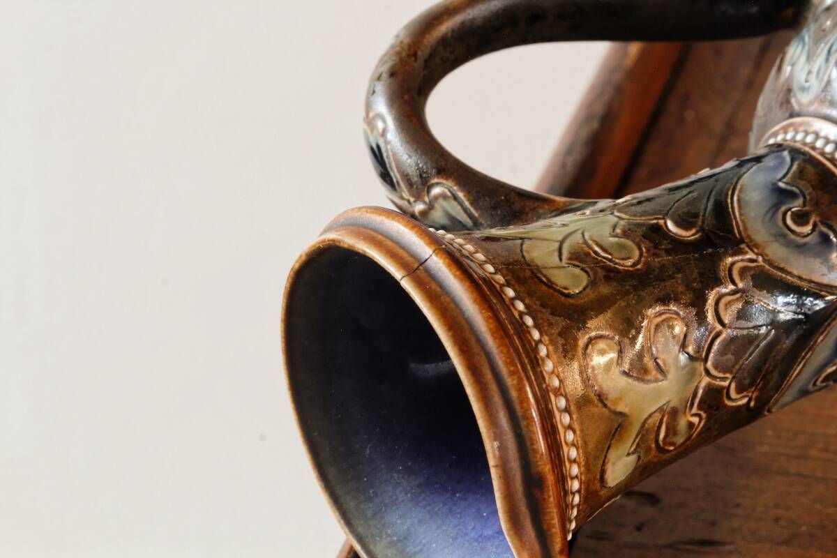 Doulton Lambeth stoneware jug (1879), floral decoration by Henry Winstanley.
