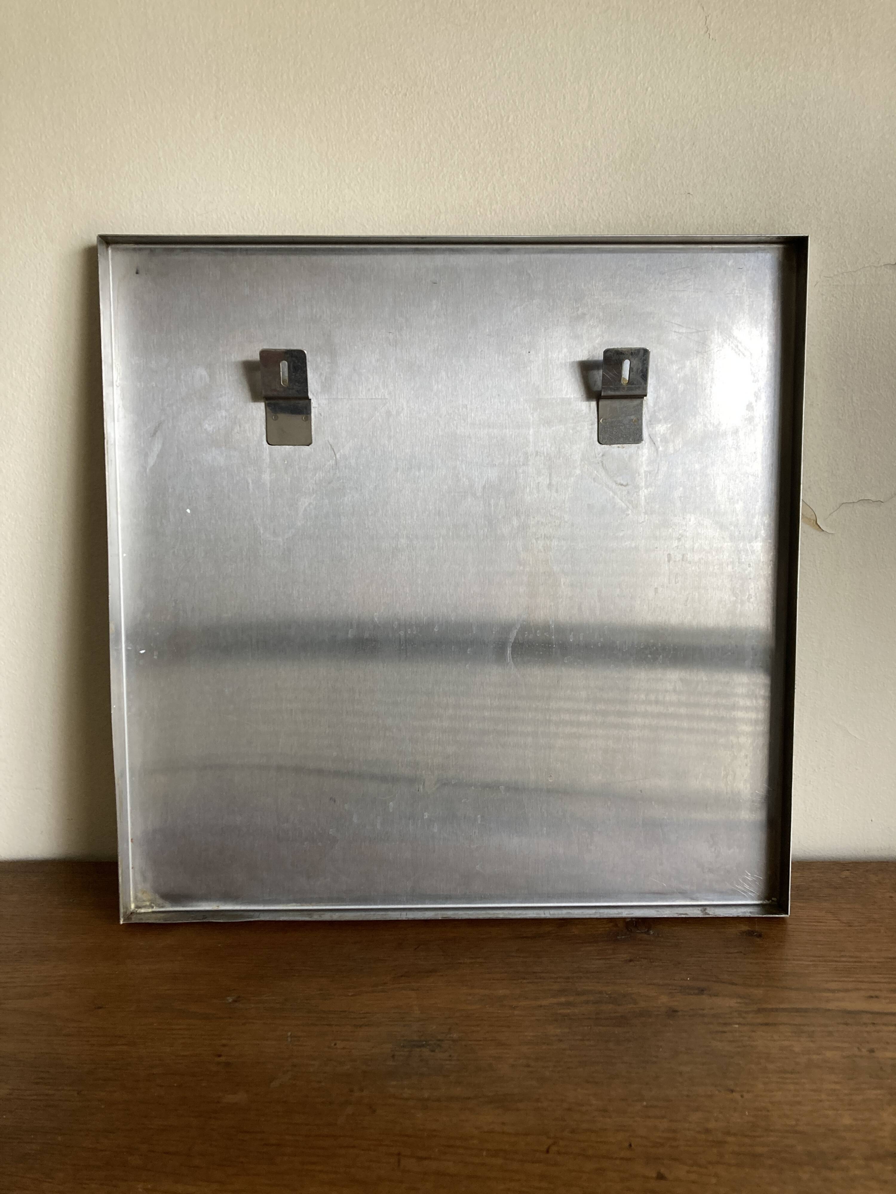 1970s space age steel mirror