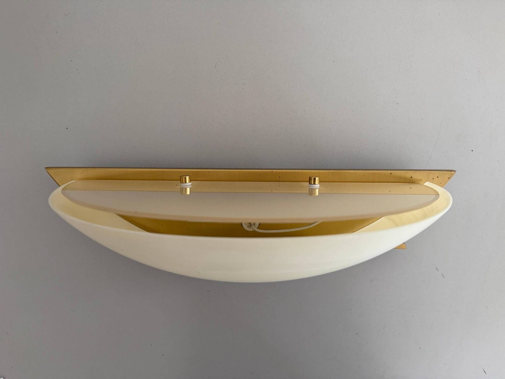 Pair of brass and glass wall lights from the Spage era, 1980, Germany.