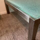 Designer garden coffee table in tempered glass and stainless steel