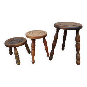 Trio of farm stools, wooden tripods