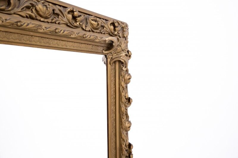 Antique mirror in richly decorated frame, France.