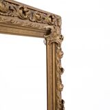 Antique mirror in richly decorated frame, France.