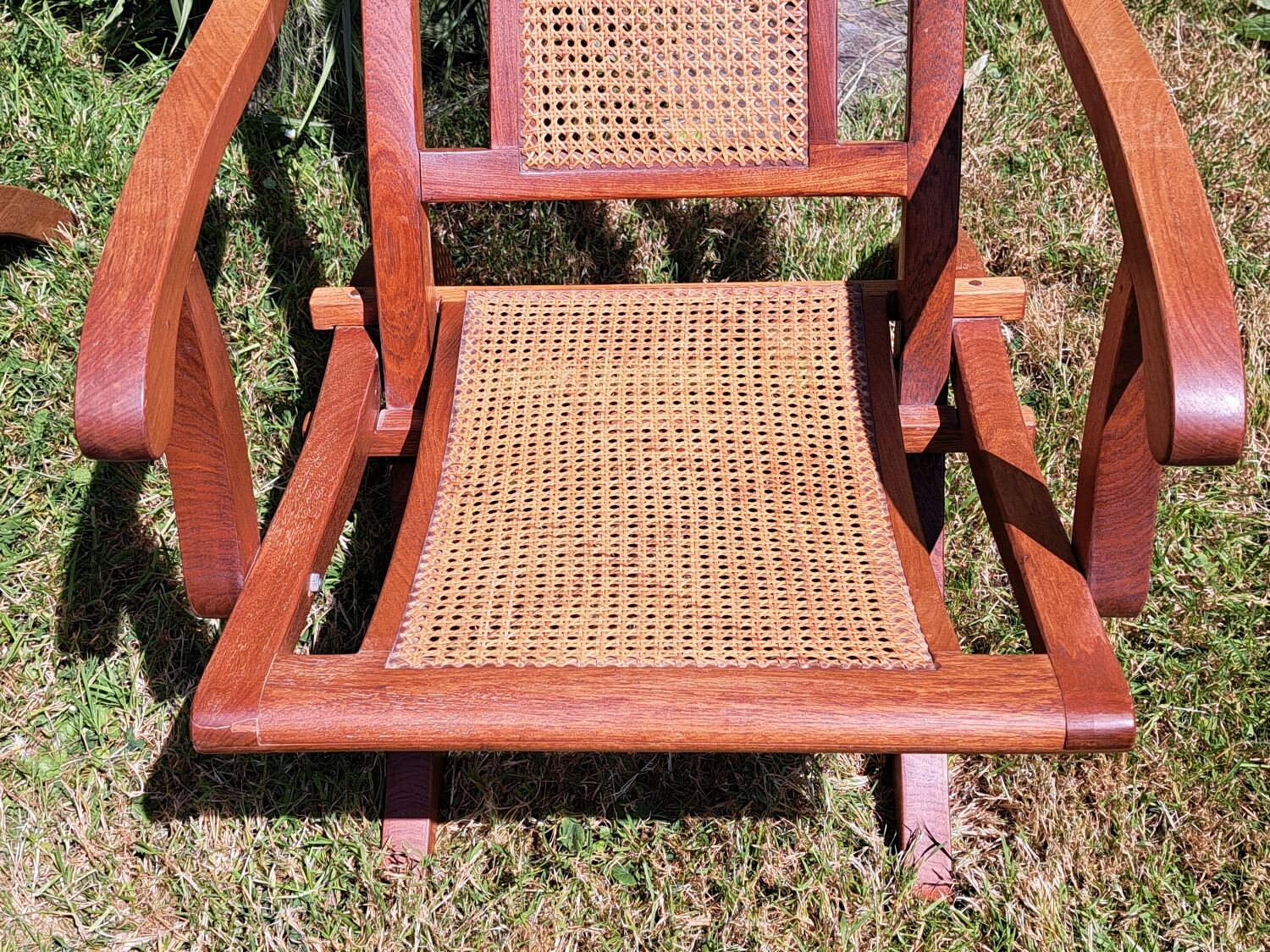 Pair of teak and cane deckchairs
