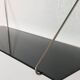 Mid-century vintage shelf in a loop shape, black glass and metal.