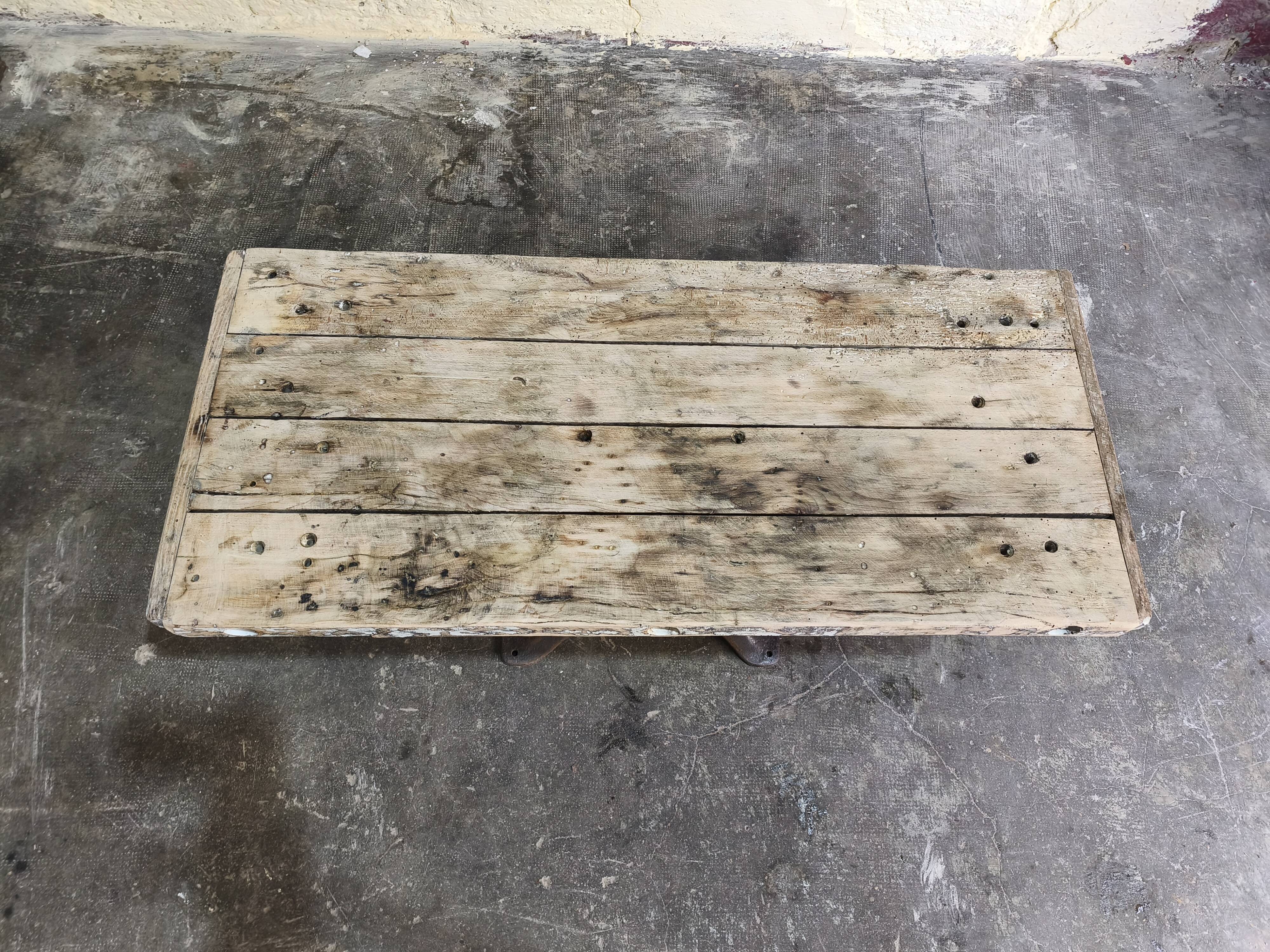 Solid oak coffee table with industrial cast iron legs