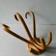 Bistro coat holder with curved wooden pads