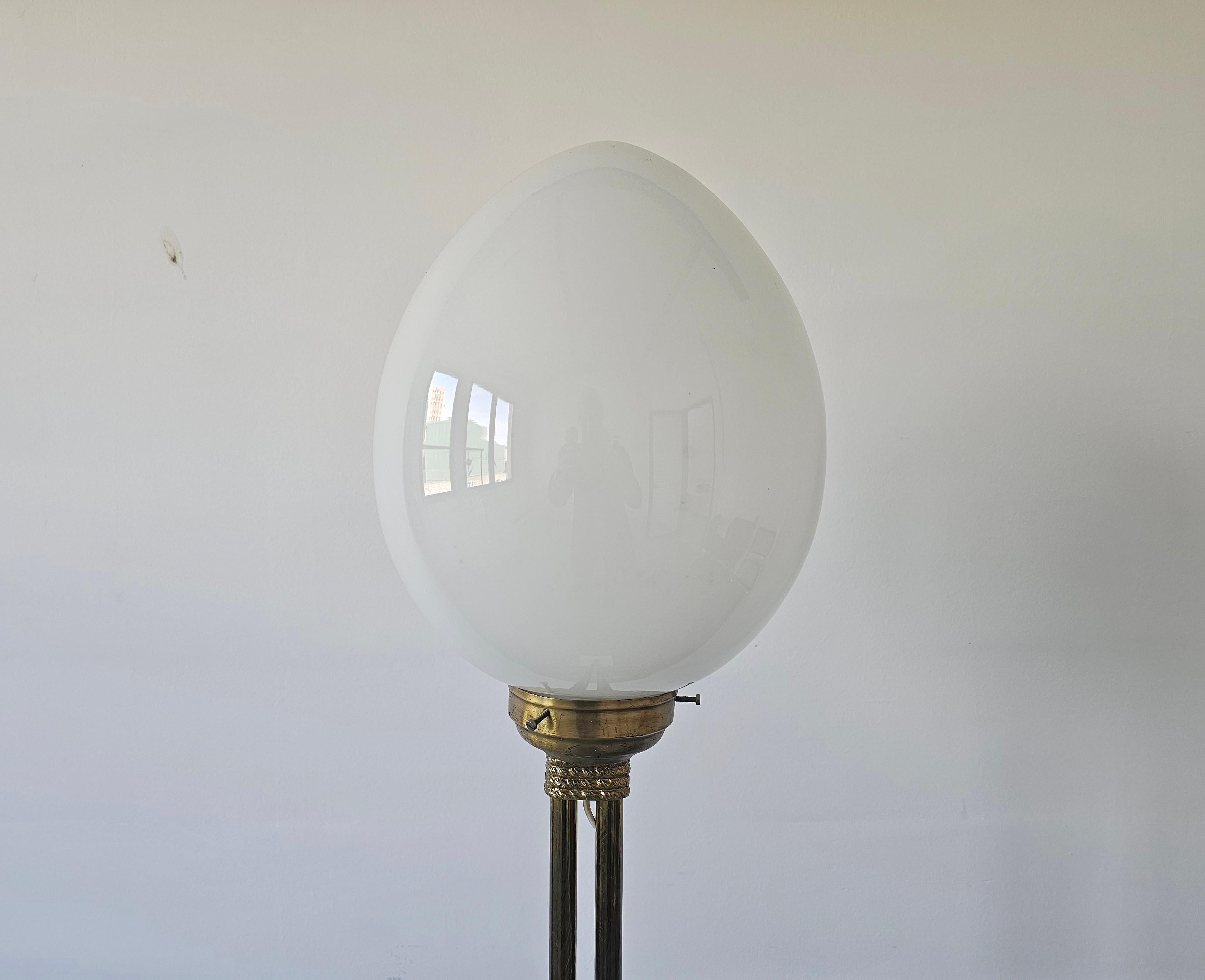 Mid-Century floor lamp with egg-shaped opal glass shade, brass base, marble base.