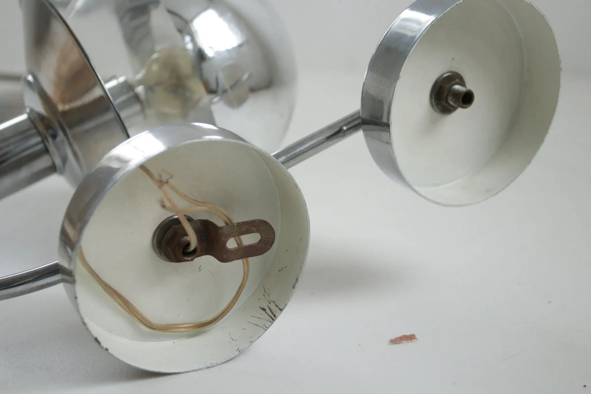 Pair of European mid-century chrome wall sconces with mirrored globe shades