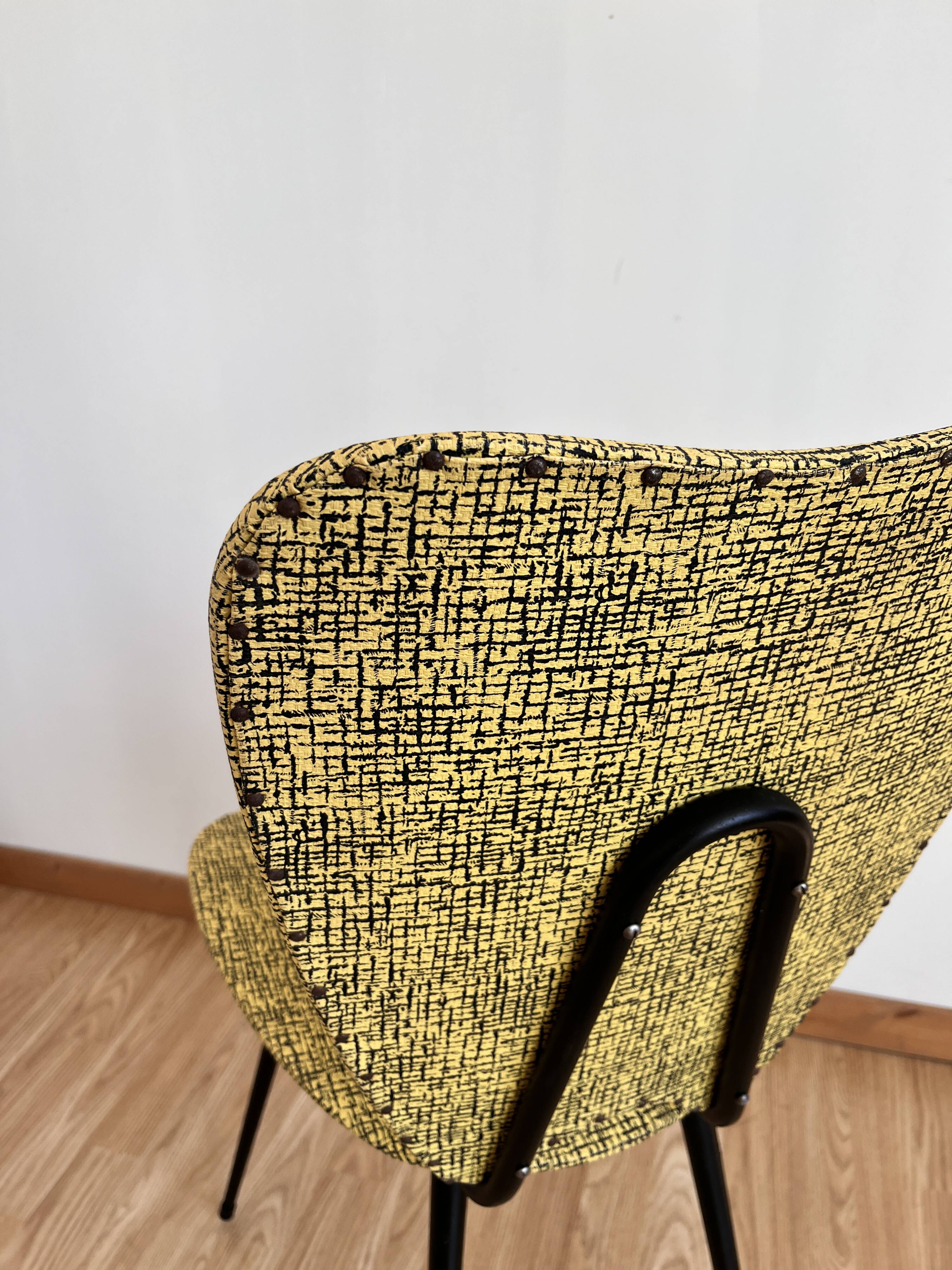 Faux leather chair assigned to Hitier.