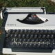Revised typewriter and Olympia Traveller luxury with his satchel
