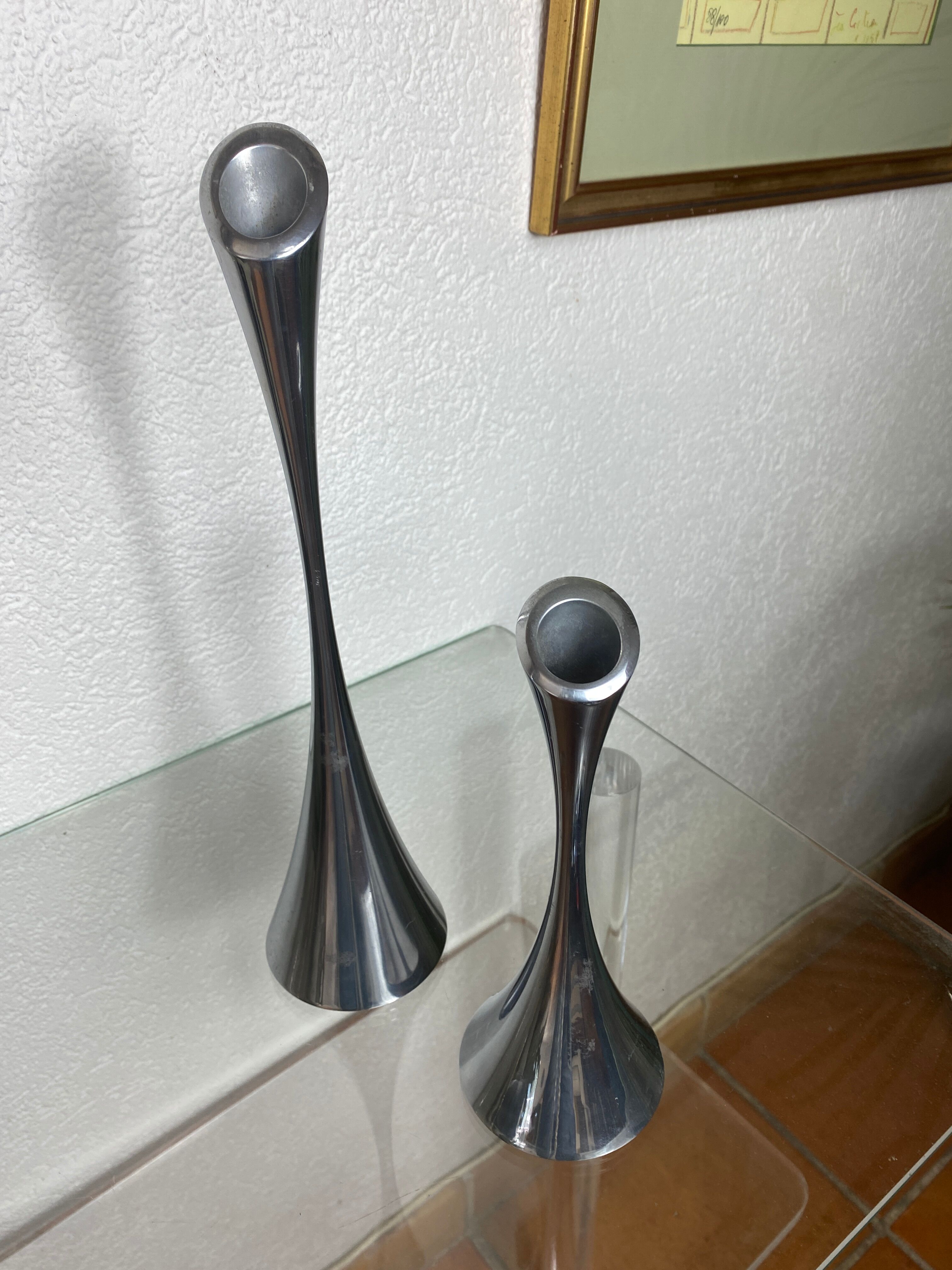 Pair of designer candle holders in stainless steel