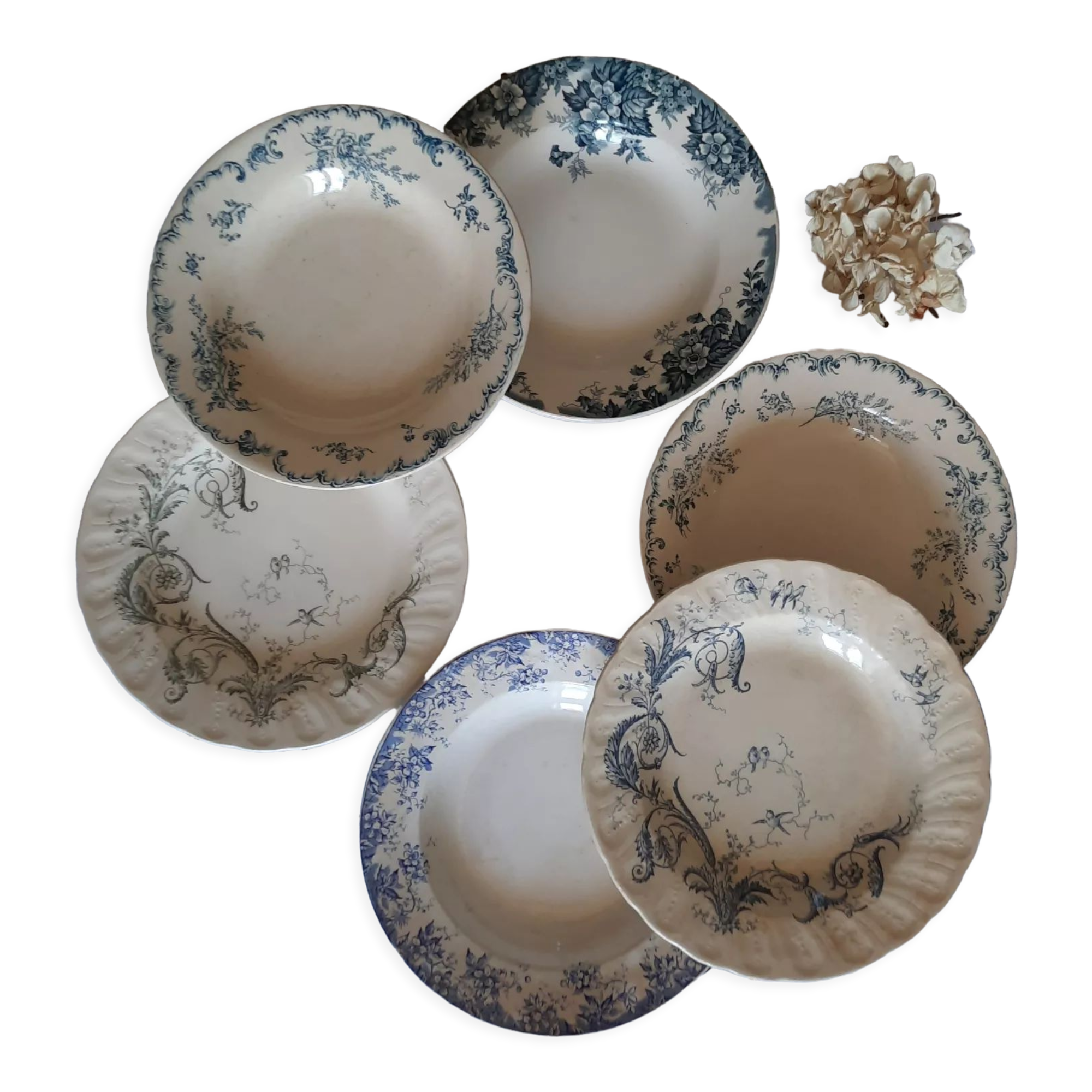 Old mismatched hollow plates in iron earth earthenware