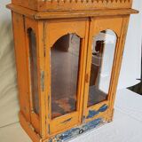 Old temple-showcase with teak offerings