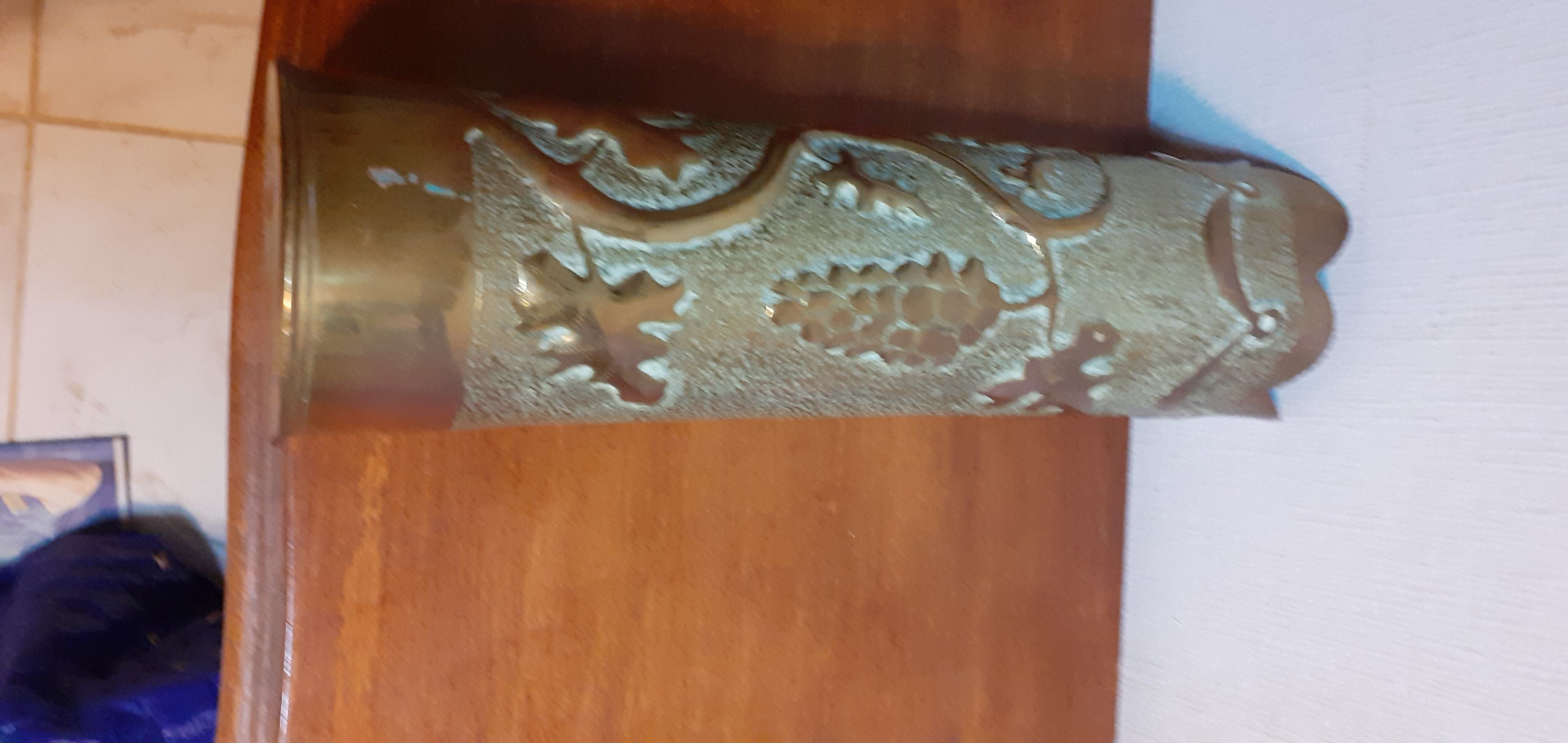 Shell casing vase carved into the trenches