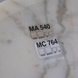 Tulip dining table in marble by Eero Saarinen for Knoll International.