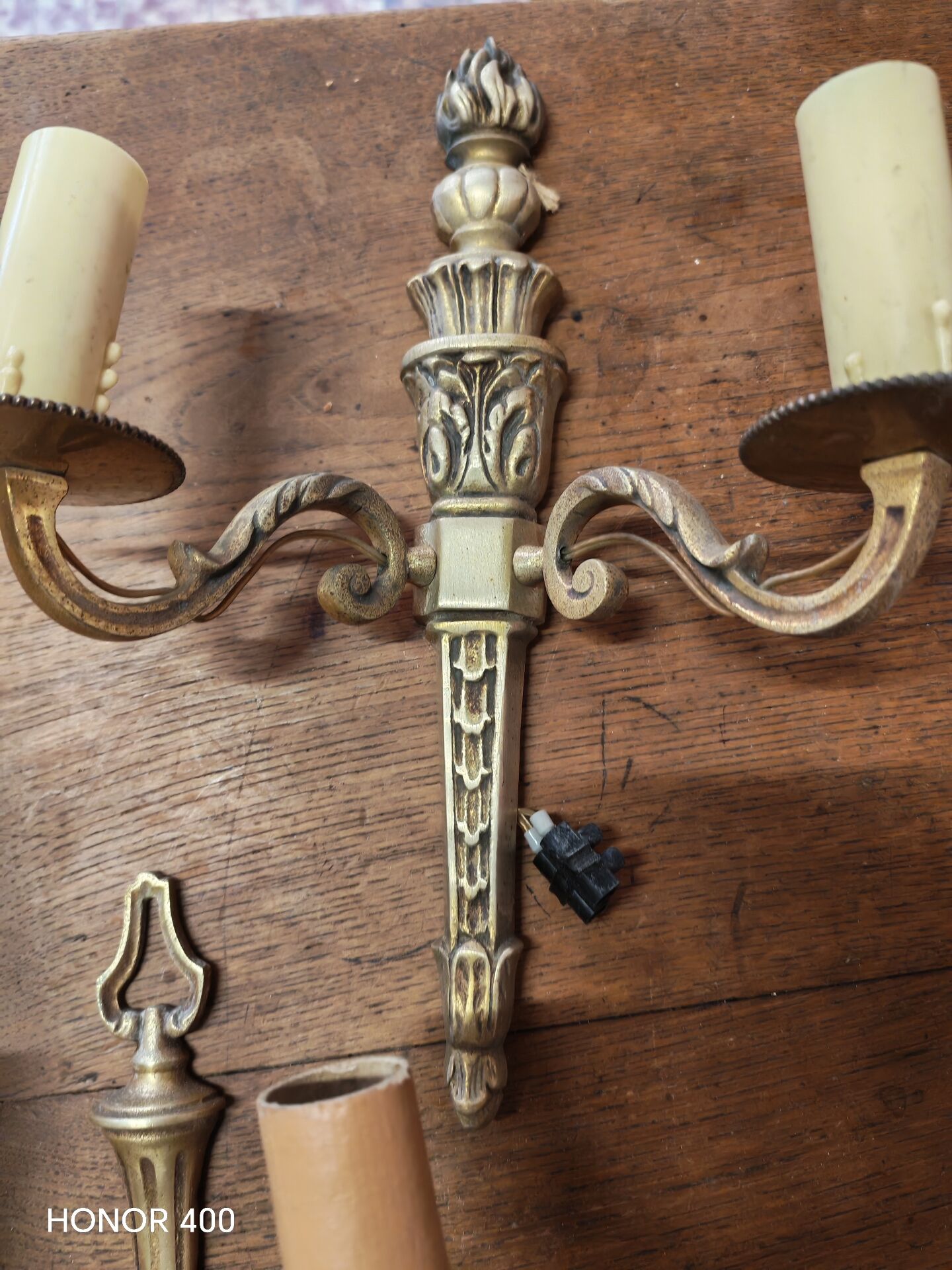 Two antique wall sconces in gilded bronze in the Louis XVI style.