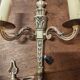 Two antique wall sconces in gilded bronze in the Louis XVI style.