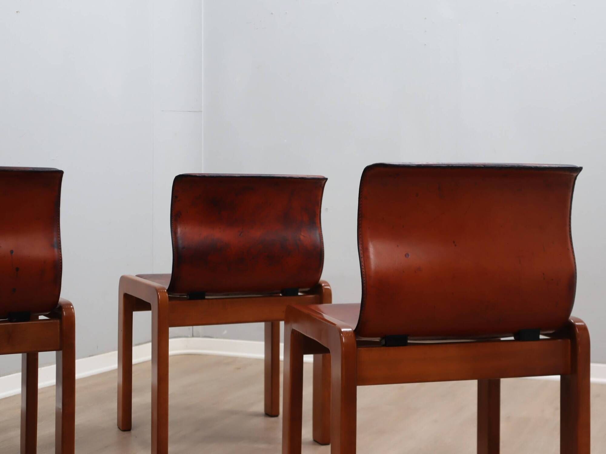 Curved wooden and leather chairs by Afra and Tobia Scarpa from the 1970s, set of 4.
