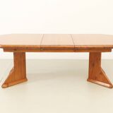 Large extendable Danish dining table in solid pine, 1970s.