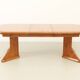 Large extendable Danish dining table in solid pine, 1970s.