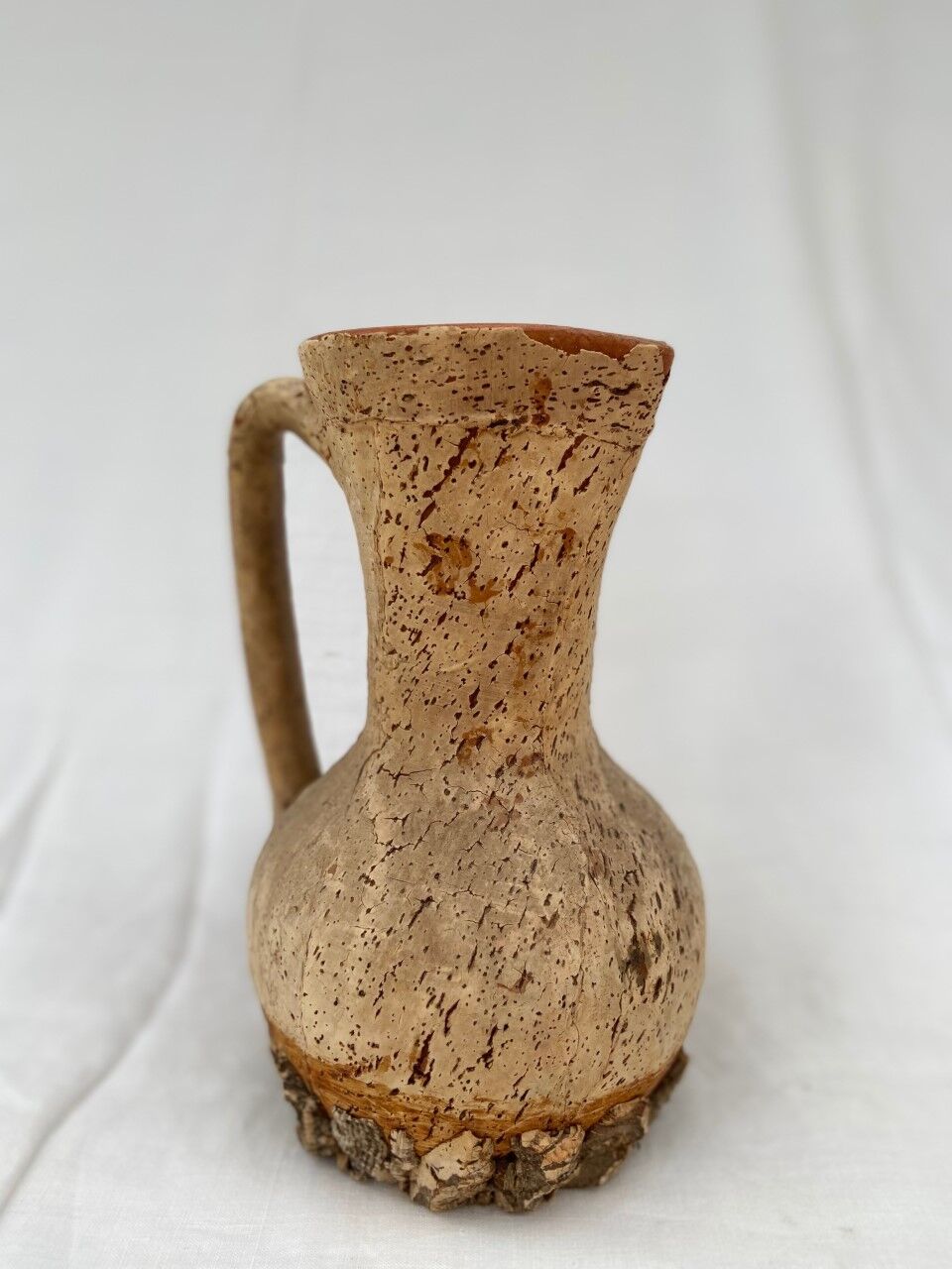 Terracotta jug covered with cork