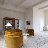 Curved mid-century floor lamp in brass and stone