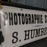 Photographer enamel sign
