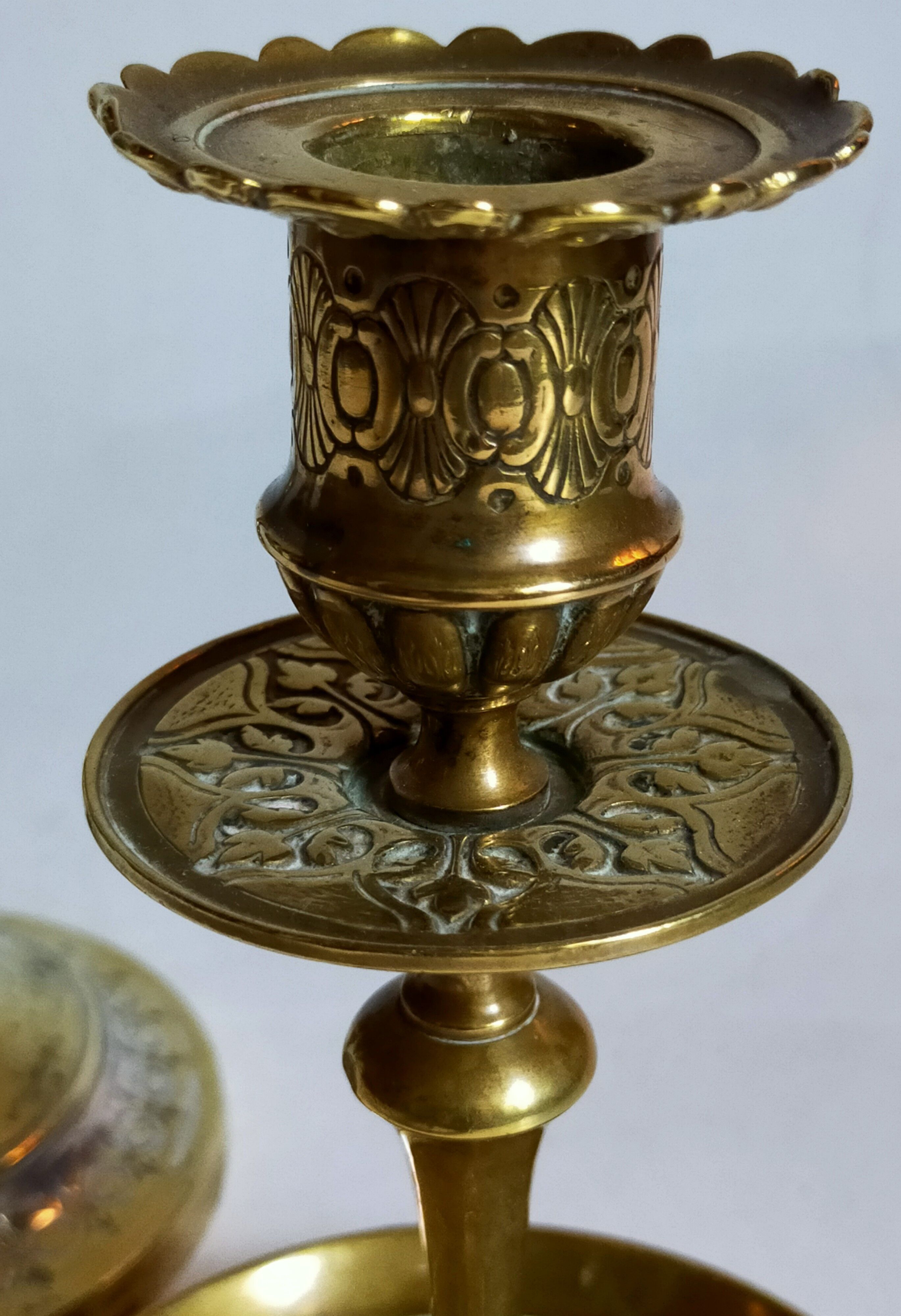 Duo of solid brass and gold metal candle holders worked old