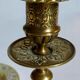 Duo of solid brass and gold metal candle holders worked old