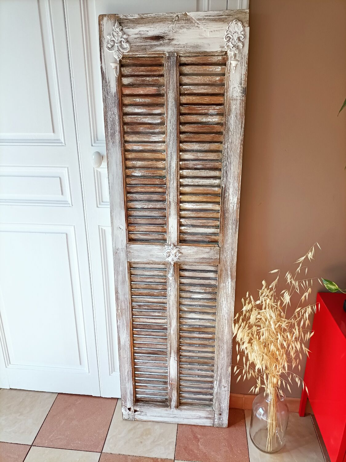 Vintage shutter renovated into a coat rack