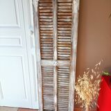 Vintage shutter renovated into a coat rack