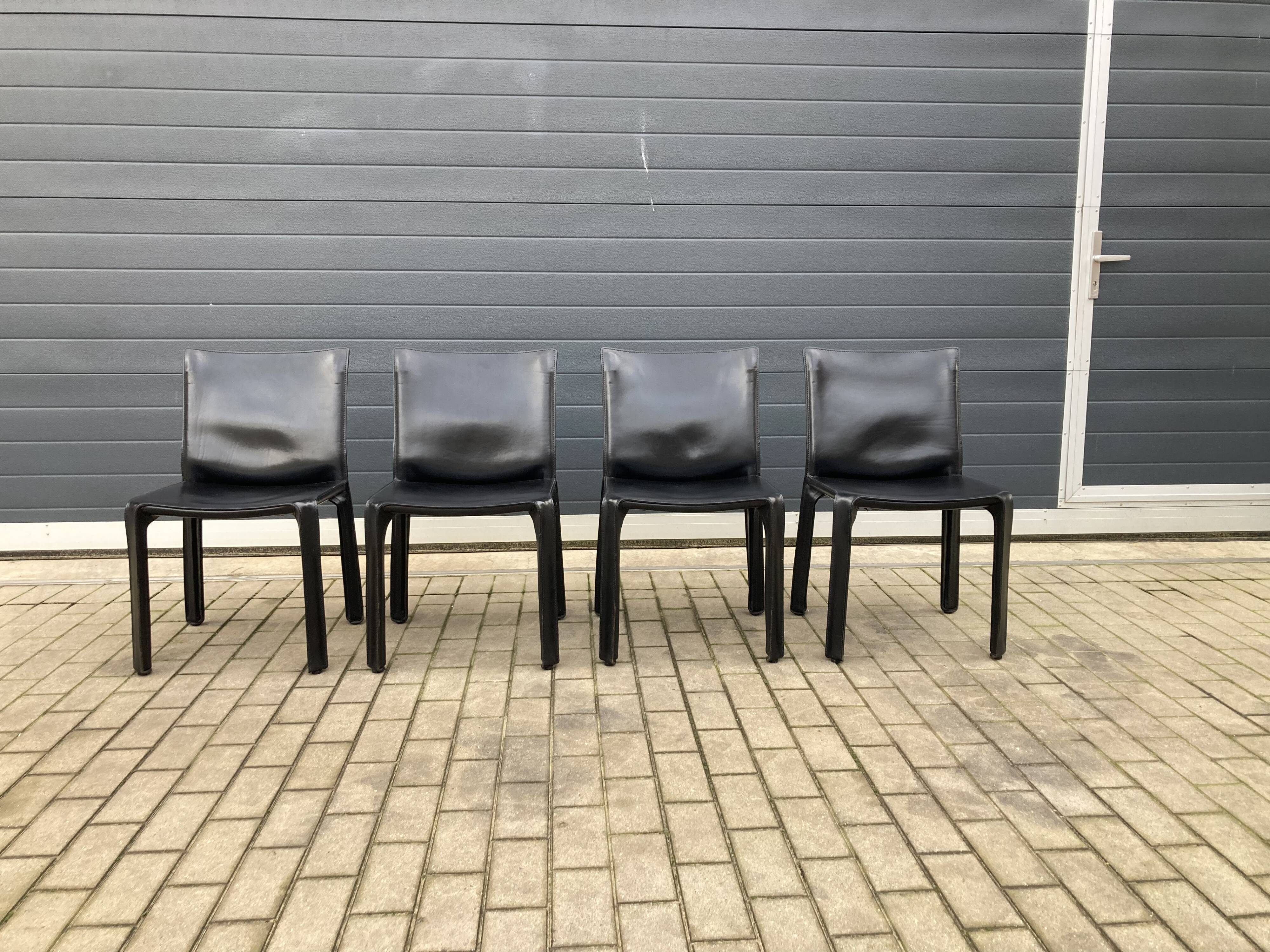4 black Cassina Cab chairs by Mario Bellini