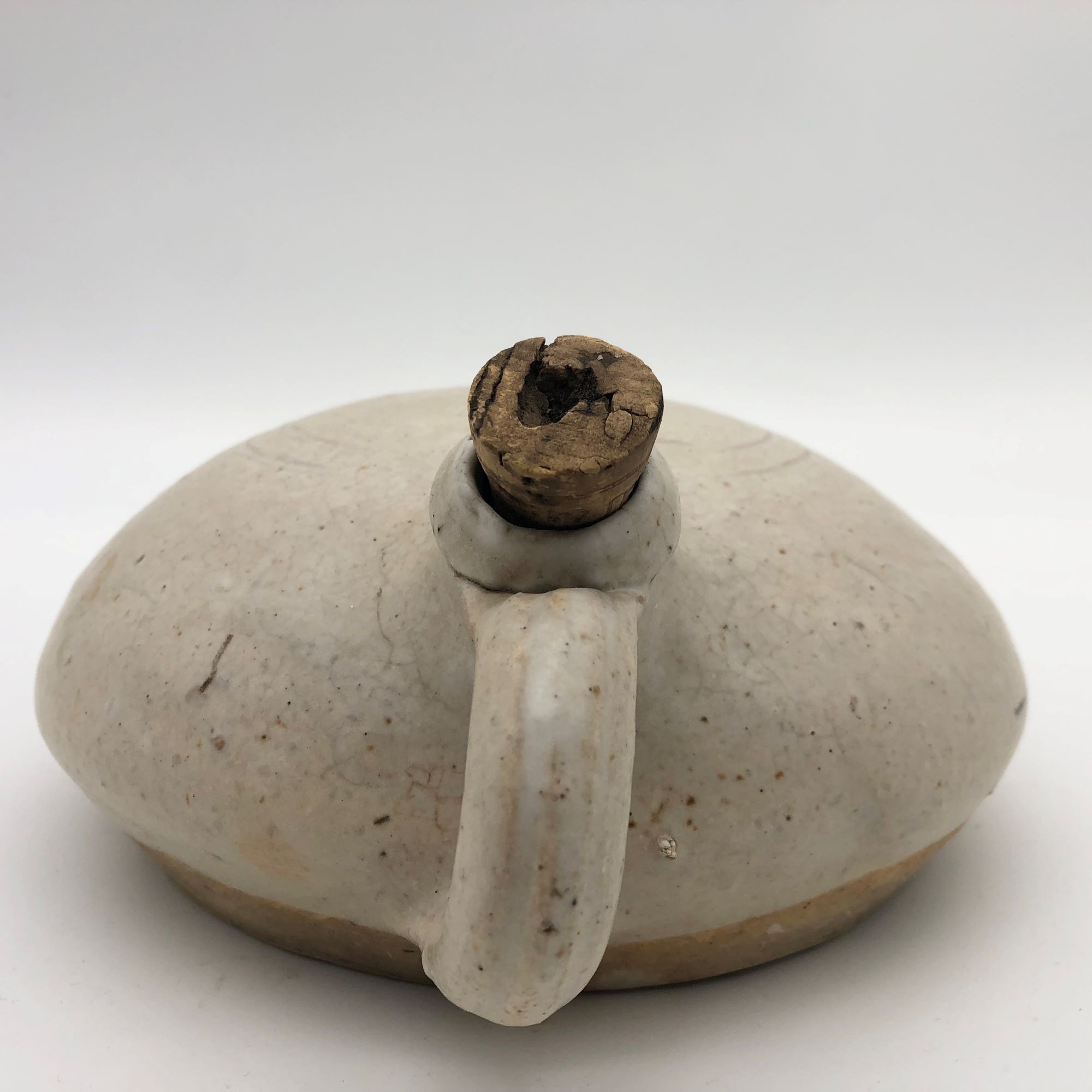 Old round sandstone hot water bottle