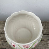 White ceramic pot cache in old flower slip