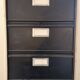 Metal column ten valves storage cabinet administration. Black mast and wood color