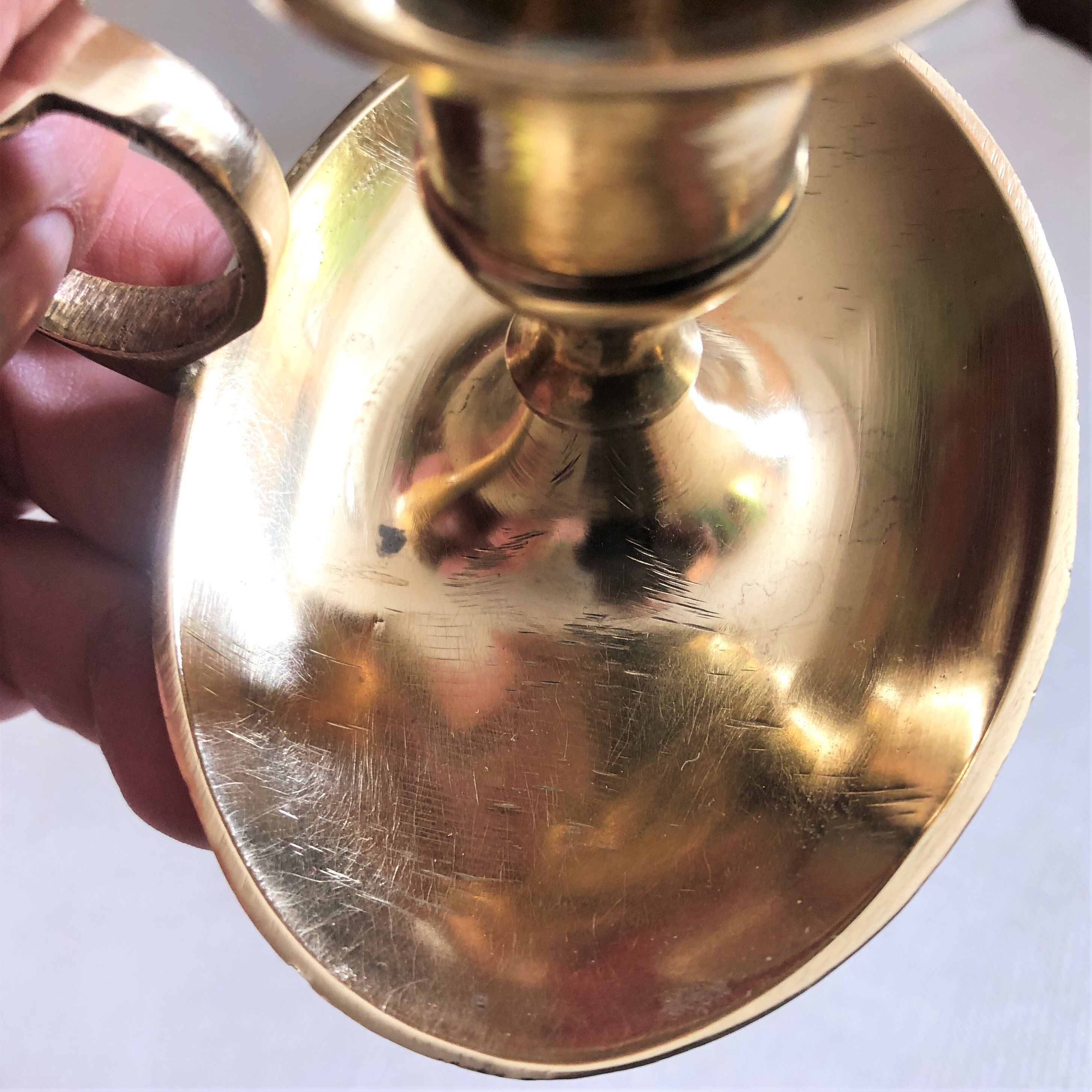 Brass oval hand candle holder