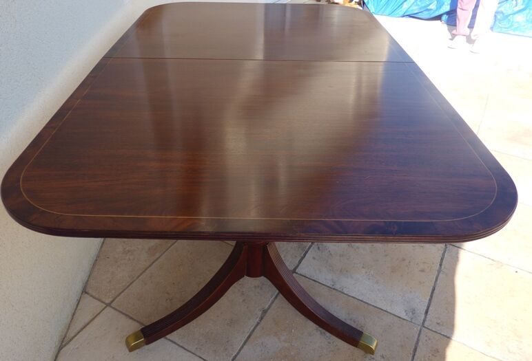 Mahogany top table inlaid with light wood nets and brass toes