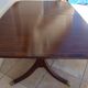 Mahogany top table inlaid with light wood nets and brass toes